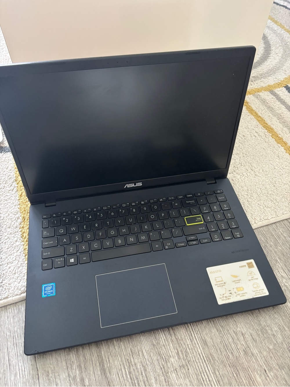 ASUS Matte Black Laptop with Highlighted Enter Key